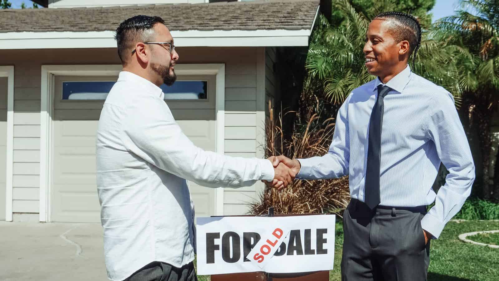 Couple receiving the keys to their first home