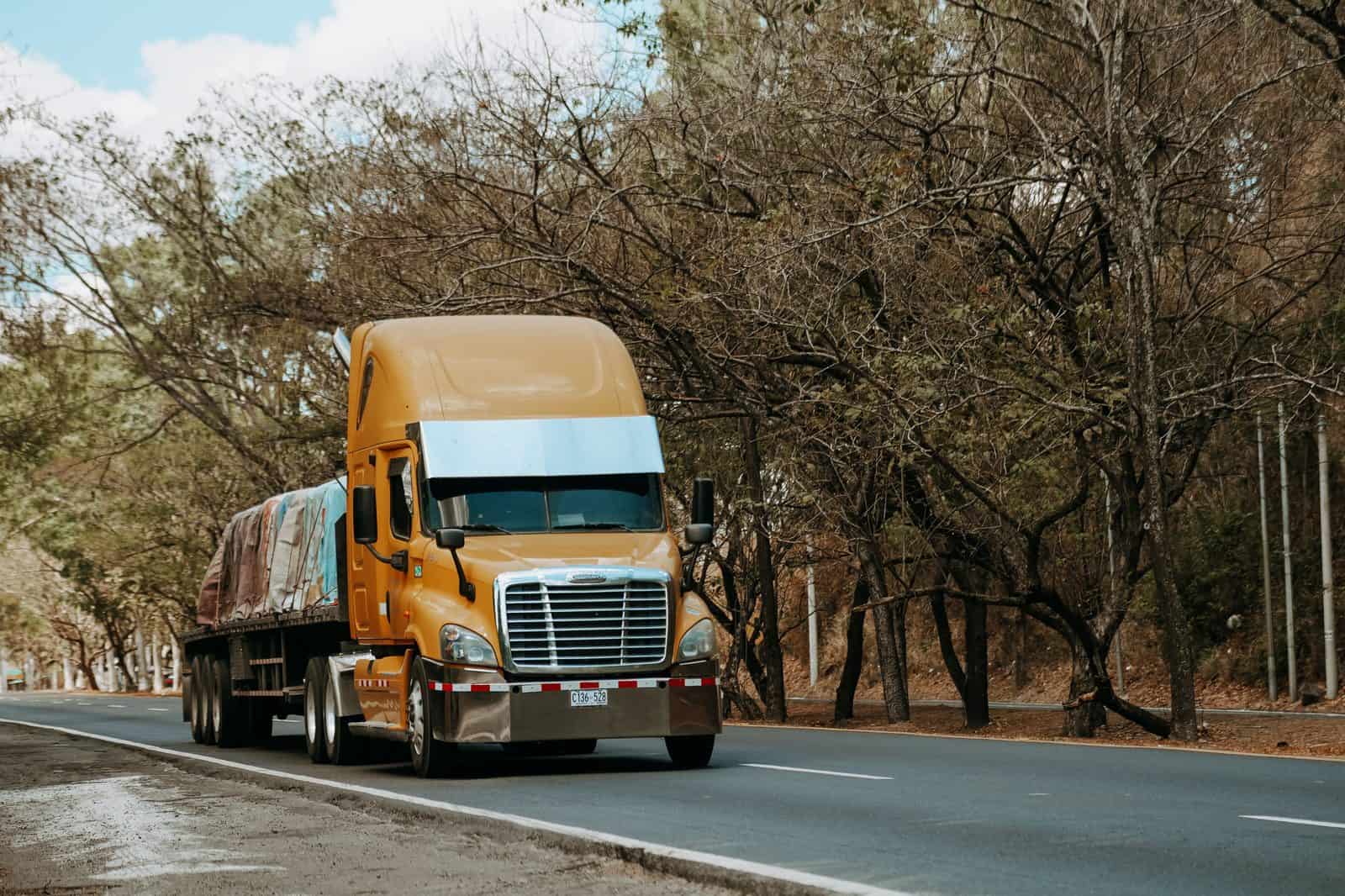 Commercial delivery trucks loaded with freight on the highway